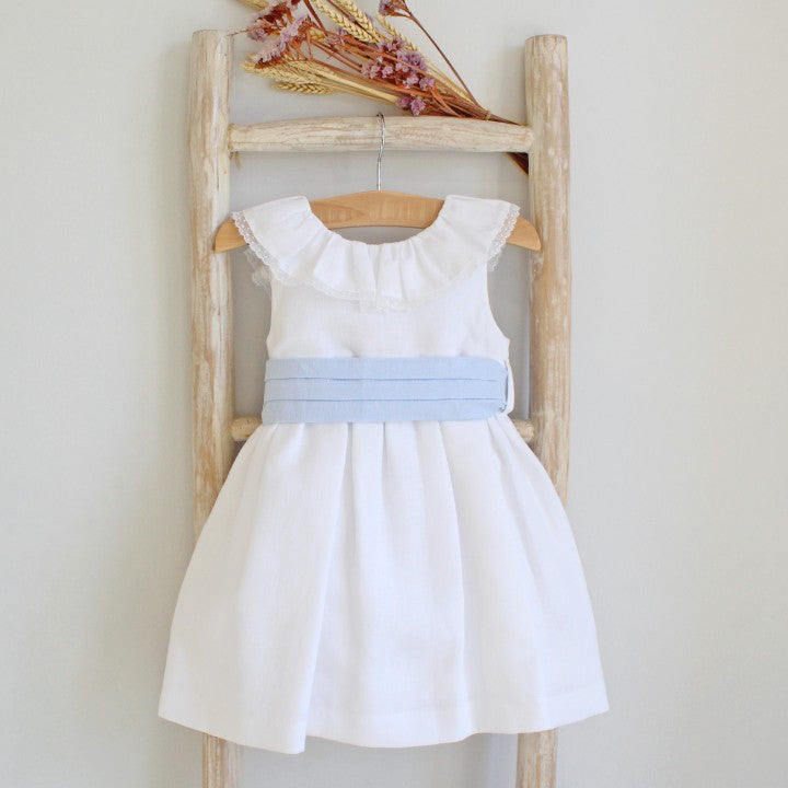 White dress with blue linen sash.
